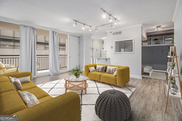 620 Peachtree St NE Unit 601, Atlanta, GA 30308 - living area with visible vents, ornamental molding, wood finished floors, baseboards, and rail lighting