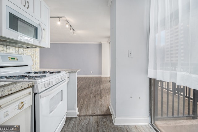 620 Peachtree St NE Unit 601, Atlanta, GA 30308 - kitchen featuring white appliances, baseboards, dark wood-style floors, and tasteful backsplash