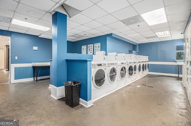 620 Peachtree St NE Unit 601, Atlanta, GA 30308 - common laundry area featuring baseboards, wainscoting, and washing machine and dryer