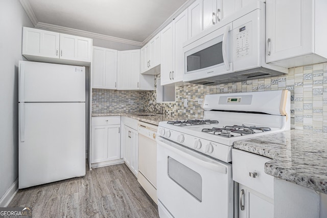 620 Peachtree St NE Unit 601, Atlanta, GA 30308 - kitchen featuring ornamental molding, white cabinetry, backsplash, and white appliances