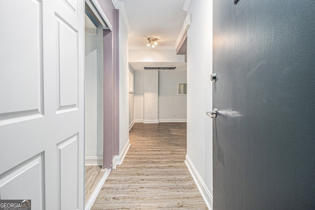 620 Peachtree St NE Unit 601, Atlanta, GA 30308 - hallway with crown molding, baseboards, and light wood-style floors