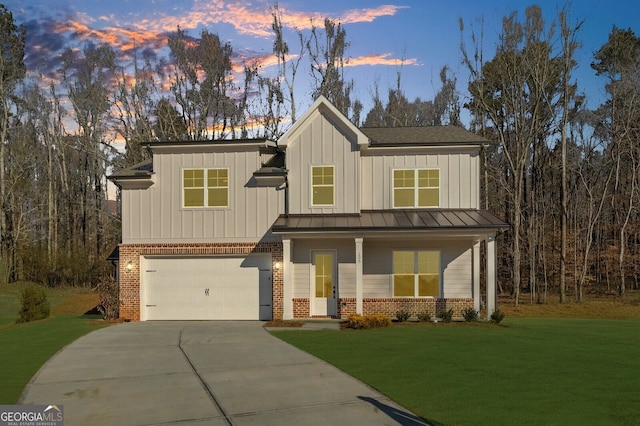 view of front facade featuring board and batten siding, brick siding, an attached garage, and driveway