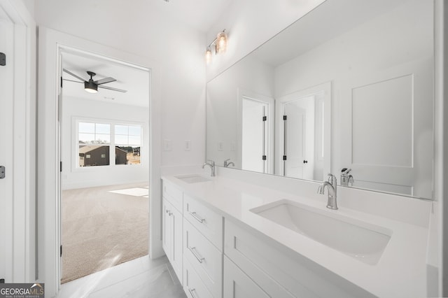 full bath featuring a sink, a ceiling fan, and double vanity
