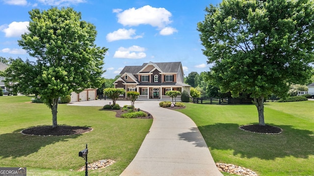 craftsman-style house featuring fence, a porch, and a front lawn