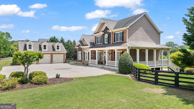 view of front of property featuring a garage, fence, a porch, and a front lawn