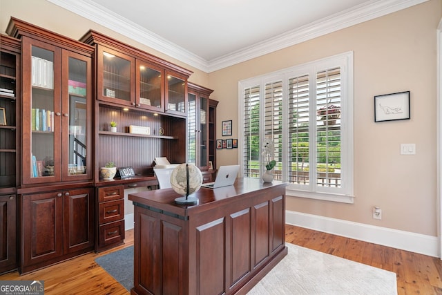 office featuring baseboards, ornamental molding, and light wood finished floors