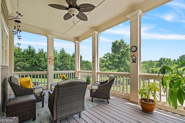 sunroom / solarium with a ceiling fan and a wealth of natural light