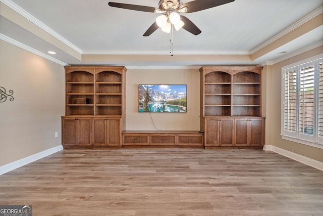 unfurnished living room featuring light wood-style floors, baseboards, ceiling fan, and ornamental molding