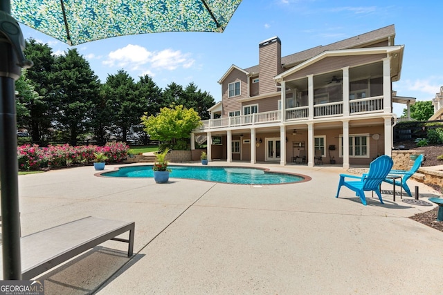 view of pool with a patio, ceiling fan, and a fenced in pool