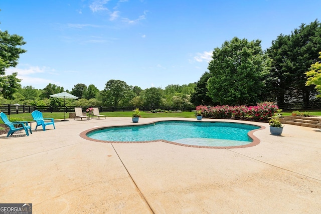 view of pool with a patio, fence, and a fenced in pool