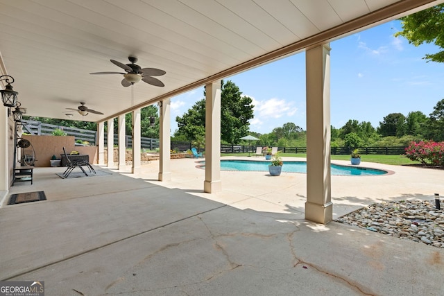 view of patio / terrace featuring a fenced in pool, a ceiling fan, and a fenced backyard