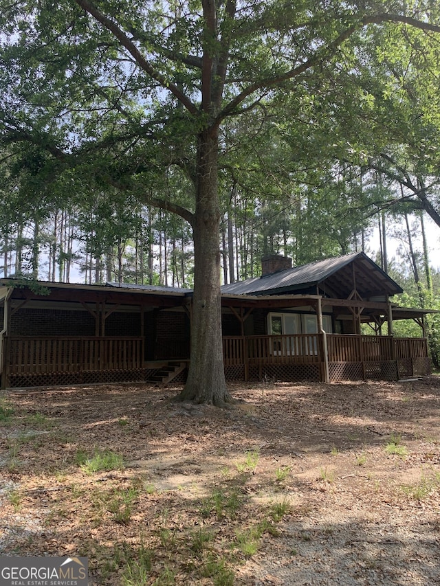 view of yard featuring a wooden deck