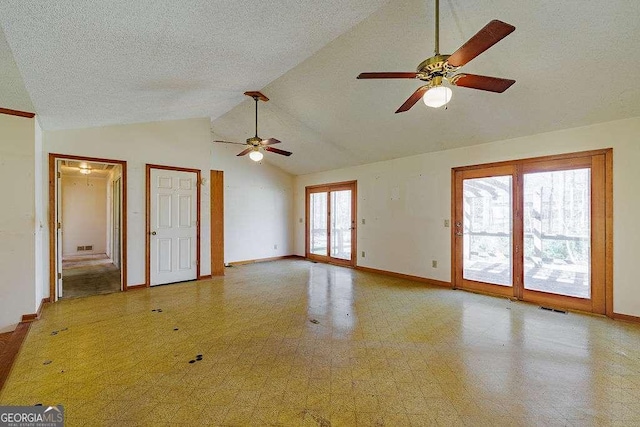 spare room with visible vents, baseboards, ceiling fan, high vaulted ceiling, and tile patterned floors