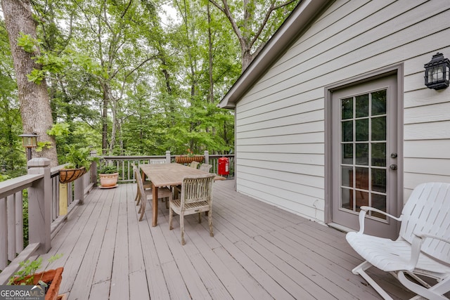 wooden deck with outdoor dining area