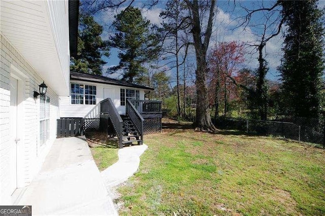 1616 W Kellogg Cir, Douglasville, GA 30134 - view of yard with fence, stairs, and a deck