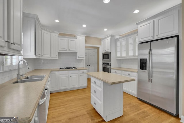 4810 Duncans Lake Dr, Buford, GA 30519 - kitchen featuring stainless steel appliances, a sink, tasteful backsplash, recessed lighting, and ornamental molding