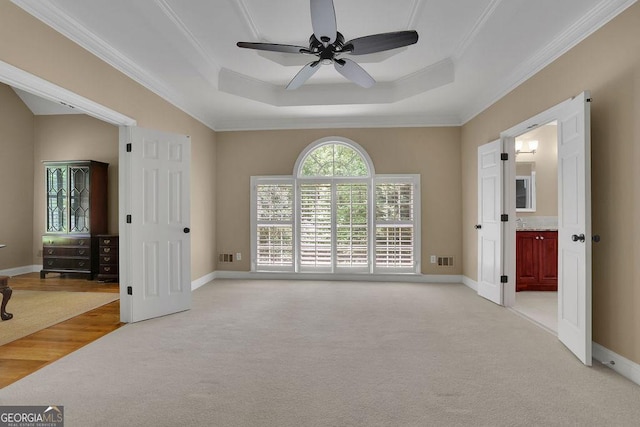 4810 Duncans Lake Dr, Buford, GA 30519 - unfurnished room with light colored carpet, ceiling fan, ornamental molding, a tray ceiling, and baseboards