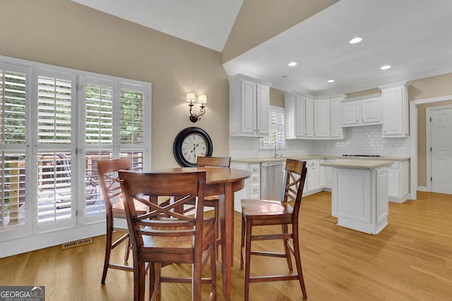 4810 Duncans Lake Dr, Buford, GA 30519 - dining space with light wood-type flooring, lofted ceiling, and recessed lighting