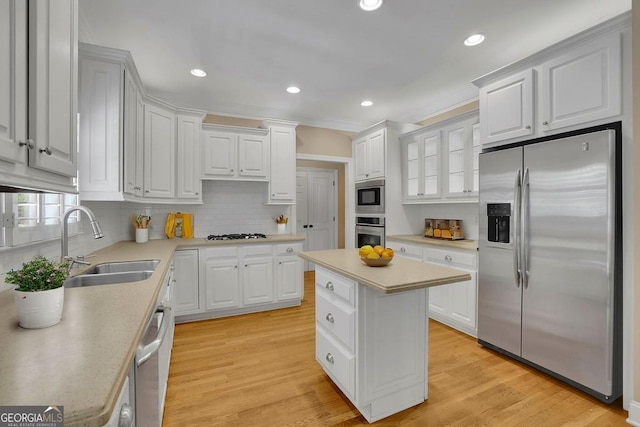 4810 Duncans Lake Dr, Buford, GA 30519 - kitchen with stainless steel appliances, a sink, tasteful backsplash, light countertops, and white cabinets