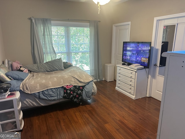 bedroom with wood finished floors