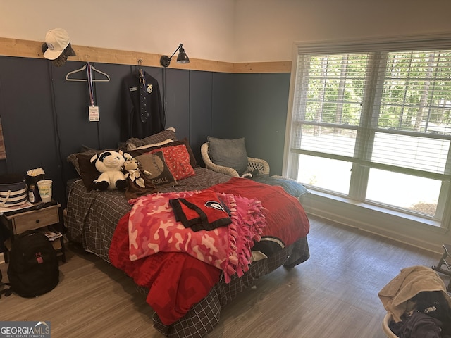bedroom with wood finished floors