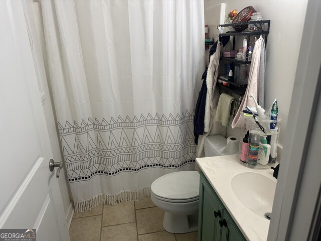 full bath featuring toilet, a shower with shower curtain, and vanity