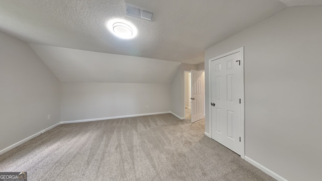 5326 Nader Pl, Stone Mountain, GA 30088 - bonus room featuring baseboards, visible vents, and vaulted ceiling