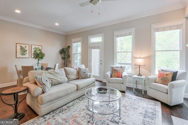 living room featuring ceiling fan, baseboards, dark wood-style floors, ornamental molding, and recessed lighting