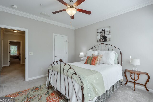 bedroom with visible vents, ornamental molding, light carpet, baseboards, and ceiling fan