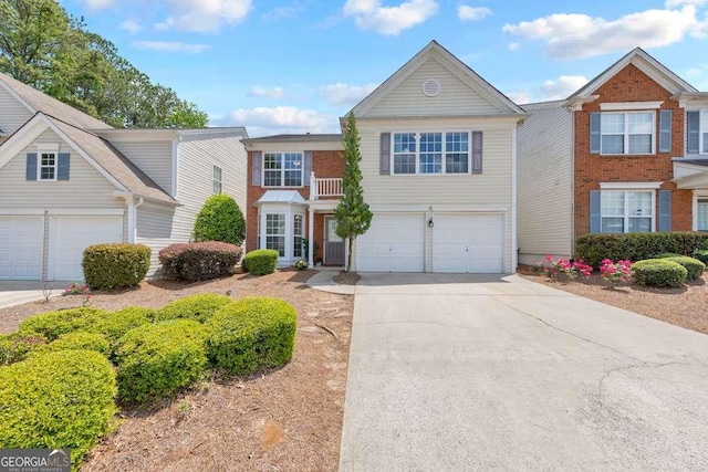 view of front of house with a garage and concrete driveway