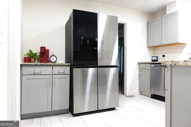875 Eleanor Ct NW, Atlanta, GA 30318 - kitchen with appliances with stainless steel finishes, gray cabinets, and light marble finish flooring
