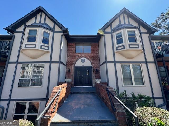6851 Roswell Rd Unit D2, Atlanta, GA 30328 - view of front of house featuring stucco siding and brick siding