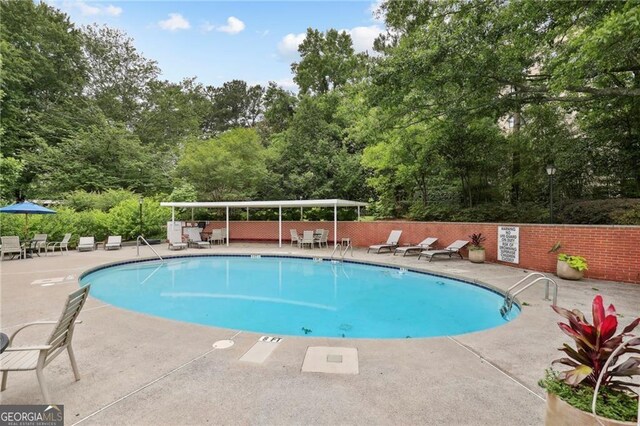 3060 Pharr Ct N Unit 607, Atlanta, GA 30305 - community pool featuring fence and a patio area