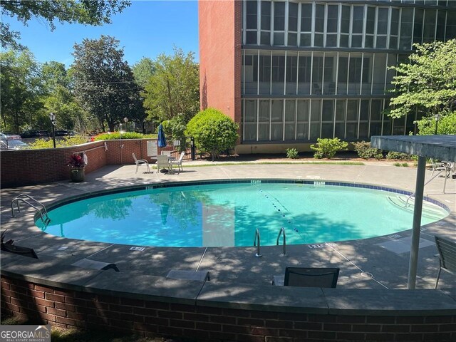 3060 Pharr Ct N Unit 607, Atlanta, GA 30305 - community pool featuring a patio