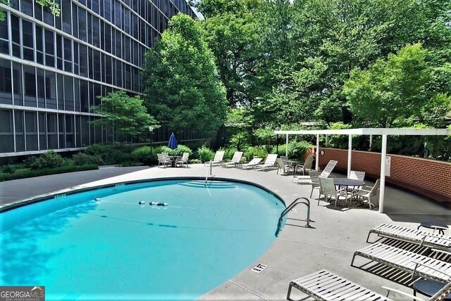 3060 Pharr Ct N Unit 607, Atlanta, GA 30305 - pool featuring fence and a patio area