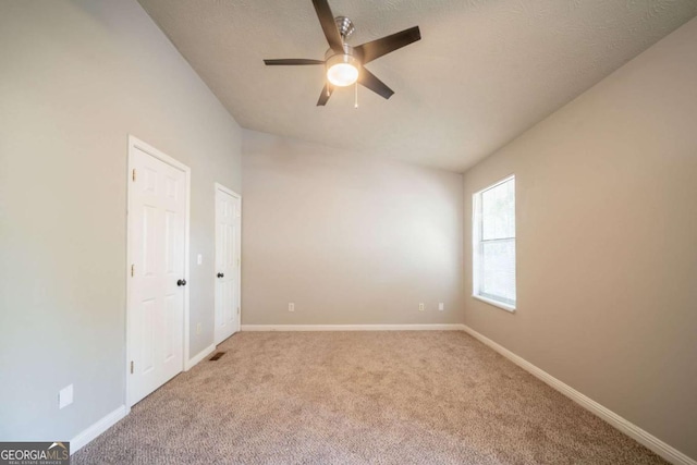 2132 Sara Ashley Way, Lithonia, GA 30058 - unfurnished bedroom featuring carpet floors, baseboards, and ceiling fan