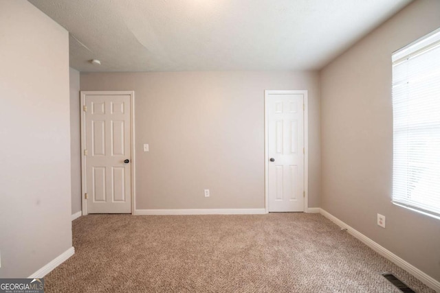 2132 Sara Ashley Way, Lithonia, GA 30058 - spare room featuring carpet floors and baseboards