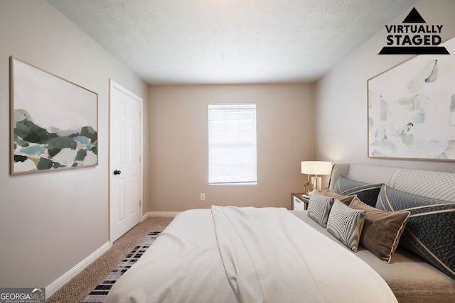 2132 Sara Ashley Way, Lithonia, GA 30058 - bedroom featuring carpet floors, baseboards, and a textured ceiling