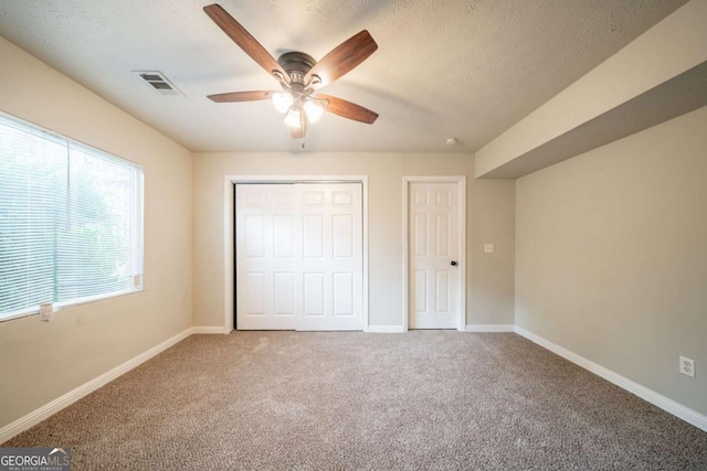 2132 Sara Ashley Way, Lithonia, GA 30058 - unfurnished bedroom with carpet flooring, a closet, and baseboards