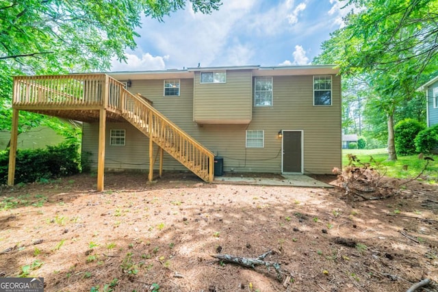 2132 Sara Ashley Way, Lithonia, GA 30058 - rear view of house with a deck, stairway, and a patio area