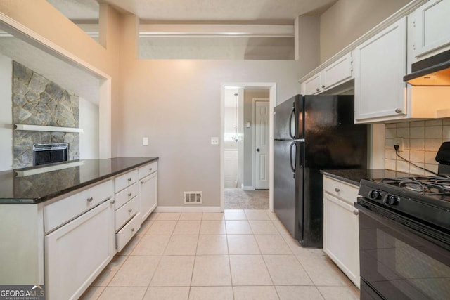 2132 Sara Ashley Way, Lithonia, GA 30058 - kitchen with black appliances, white cabinets, tasteful backsplash, dark stone countertops, and a fireplace