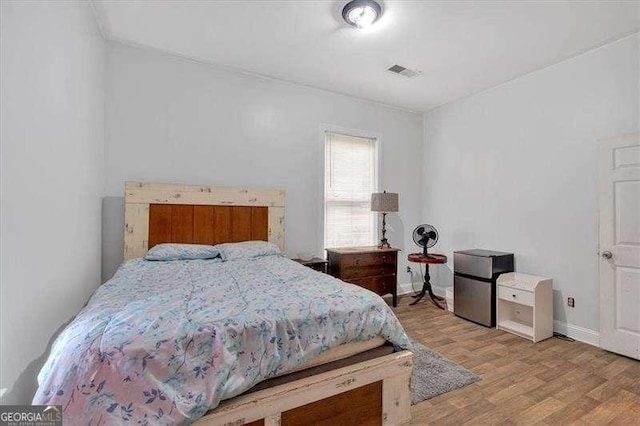 902 Allene Ave SW, Atlanta, GA 30310 - bedroom with baseboards, visible vents, and wood finished floors