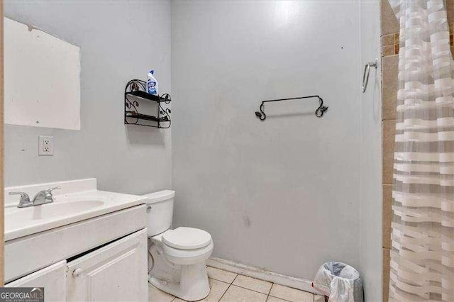 902 Allene Ave SW, Atlanta, GA 30310 - bathroom with vanity, a shower with shower curtain, tile patterned floors, and toilet
