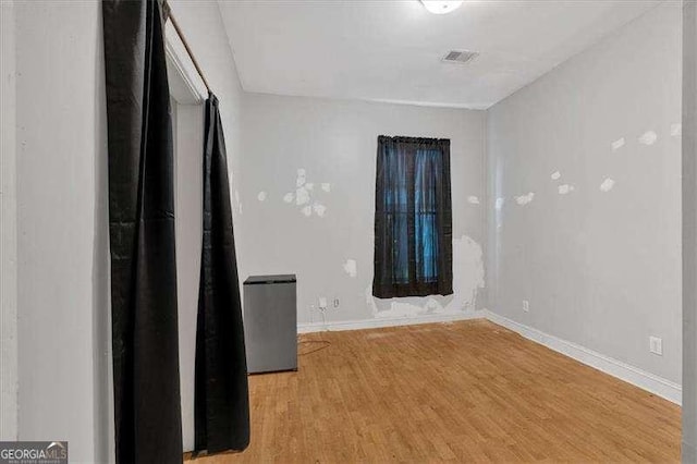 902 Allene Ave SW, Atlanta, GA 30310 - empty room featuring baseboards, visible vents, and light wood finished floors
