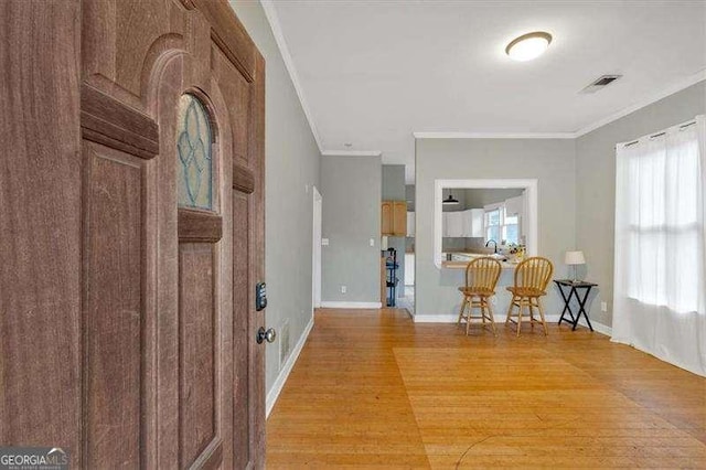 902 Allene Ave SW, Atlanta, GA 30310 - entryway with crown molding, baseboards, visible vents, and light wood-type flooring