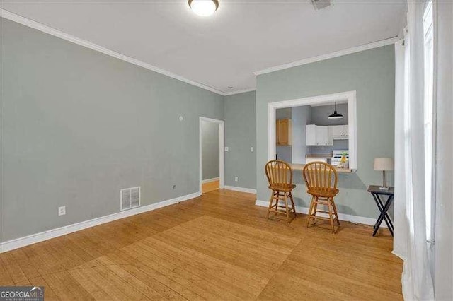 902 Allene Ave SW, Atlanta, GA 30310 - interior space featuring baseboards, visible vents, ornamental molding, and light wood-style floors