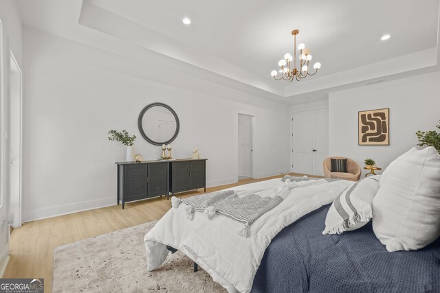 34 Candler Rd NE, Atlanta, GA 30317 - bedroom featuring baseboards, recessed lighting, a raised ceiling, a chandelier, and light wood-style flooring