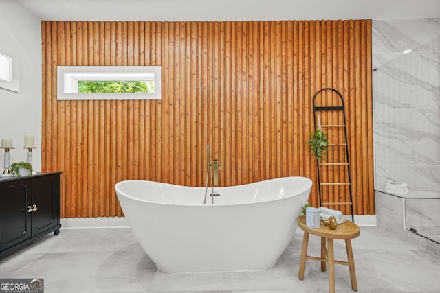 34 Candler Rd NE, Atlanta, GA 30317 - full bath featuring marble finish floor, a freestanding tub, and wood walls