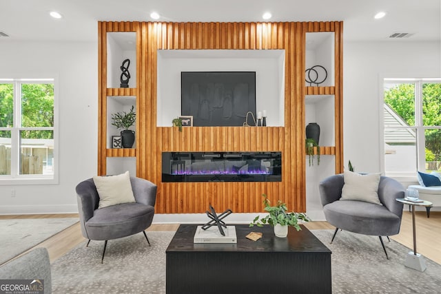34 Candler Rd NE, Atlanta, GA 30317 - living area featuring recessed lighting, visible vents, a wealth of natural light, and wood finished floors