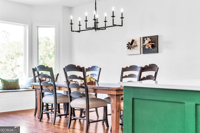 703 Cherokee Hls, Hiawassee, GA 30546 - dining space featuring a notable chandelier and wood finished floors